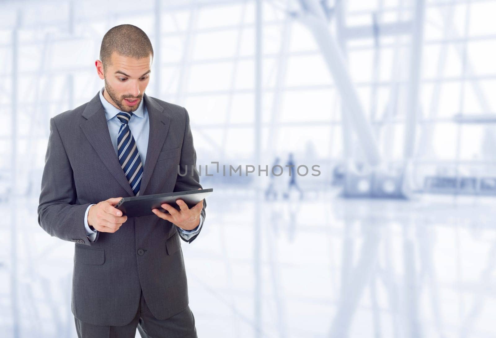 young businessman working with a tablet pc, at the office