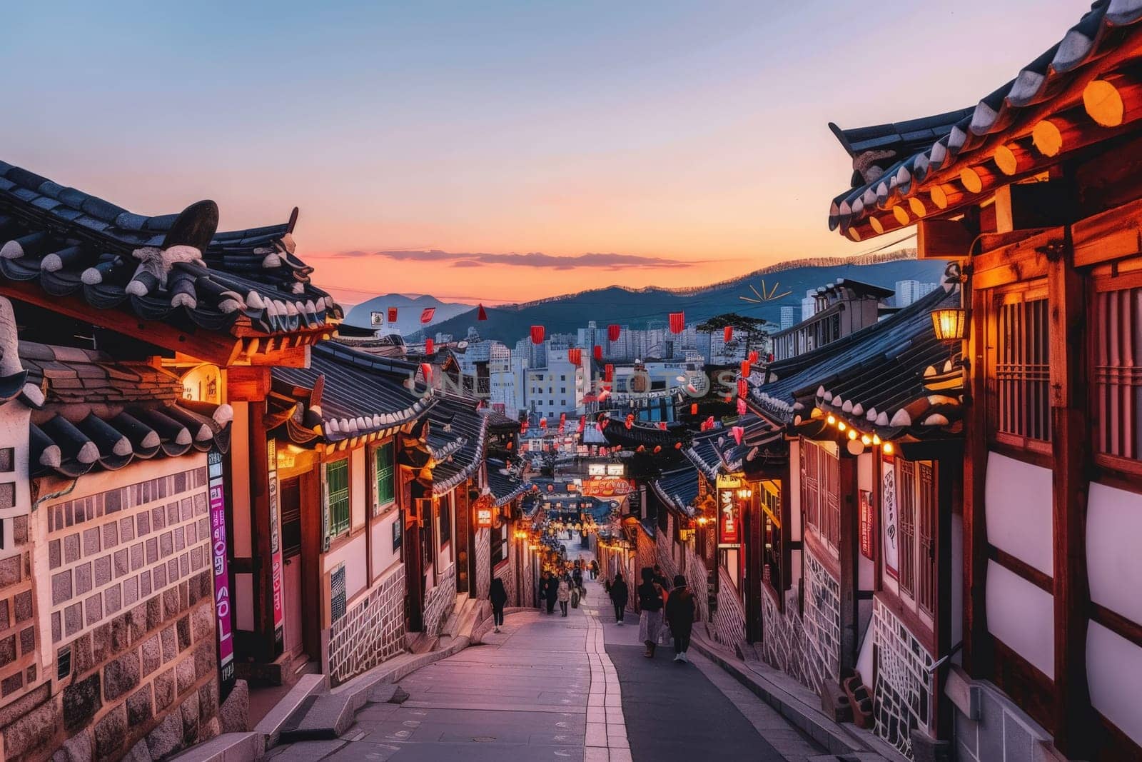 A narrow street in South Korea lined with traditional buildings and glowing lanterns, creating a magical and charming atmosphere.