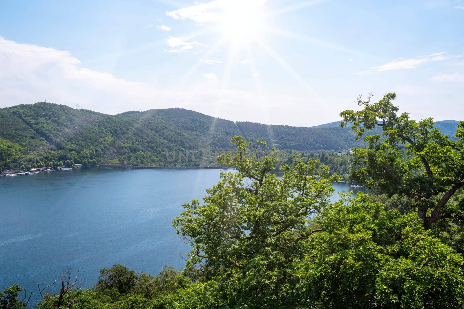 View of the Staimauer from Lake Edersee with blue sky and clouds, in Hesse, Germany