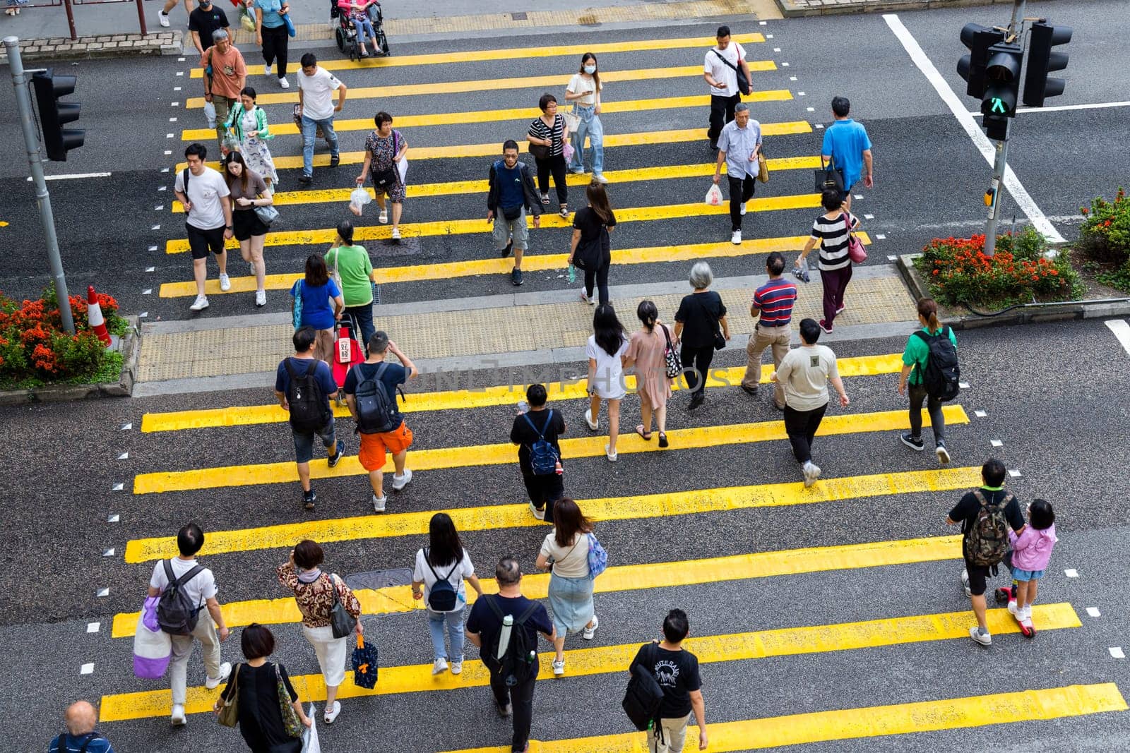 Hong Kong 28 April 2024: Top down view of people cross the zebra road
