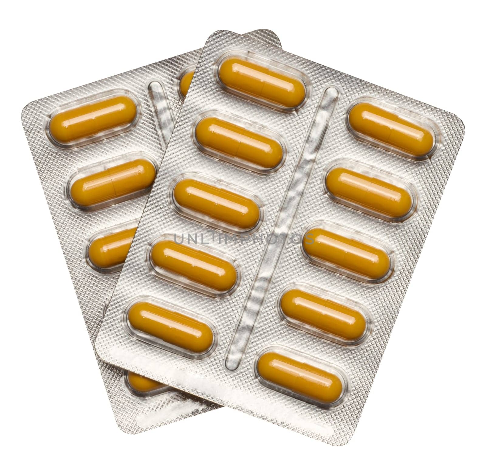 Oval tablets in aluminum blister pack on isolated background, top view