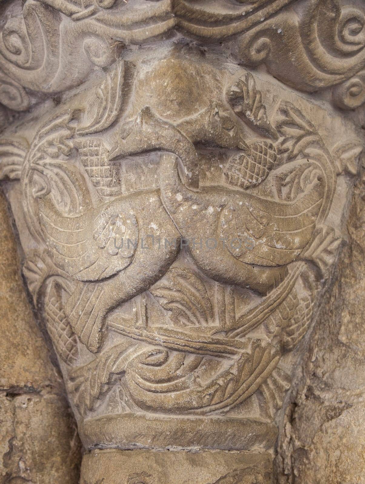 Romanesque portico of Church of Crucifijo, Puente La Reina, Navarre, Spain. Capital decorated  with linked necks geese