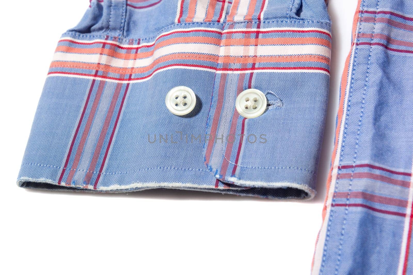 Frayed sleeve cuff on long sleeve men's shirt on white background