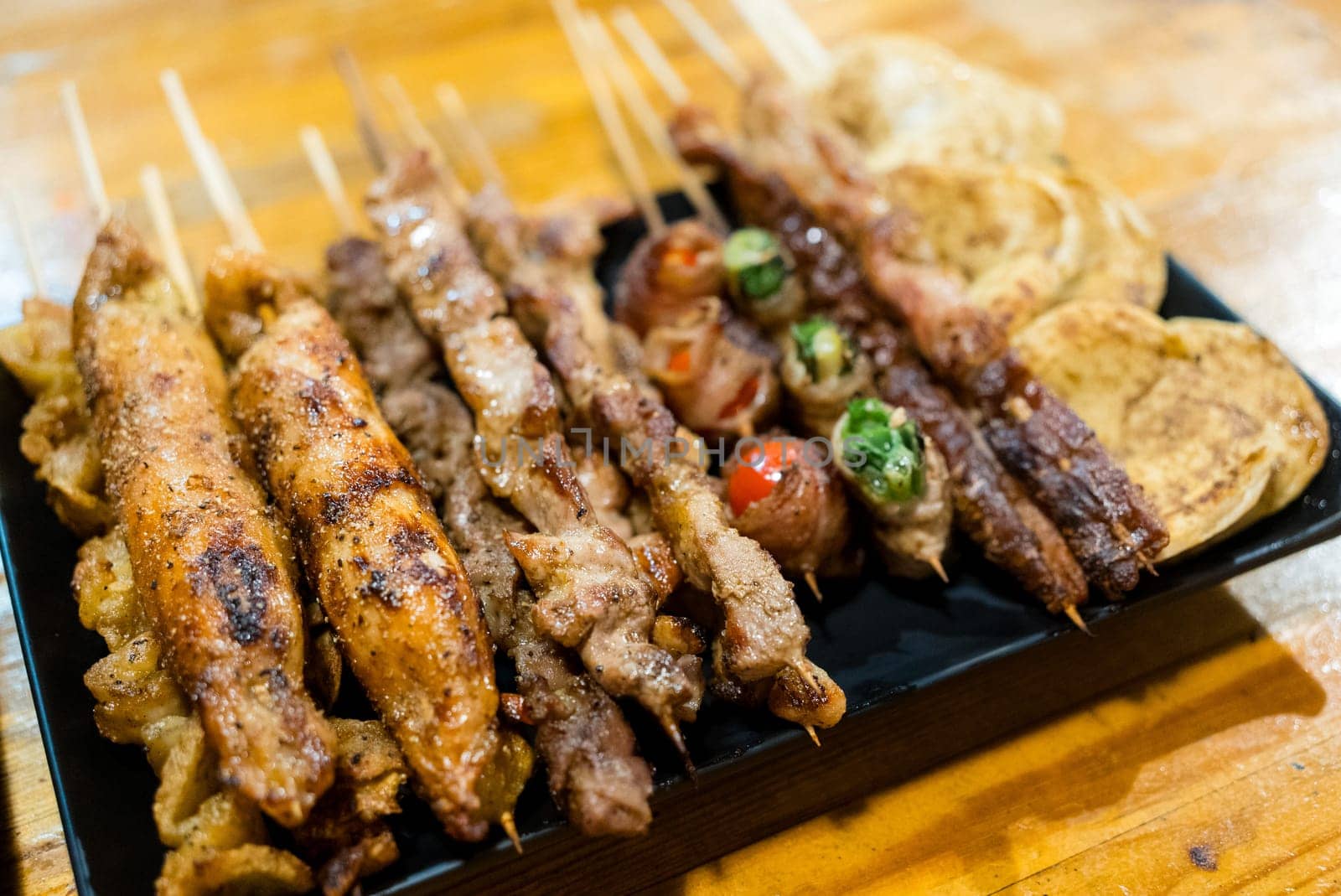 Variety of meat skewers on dish