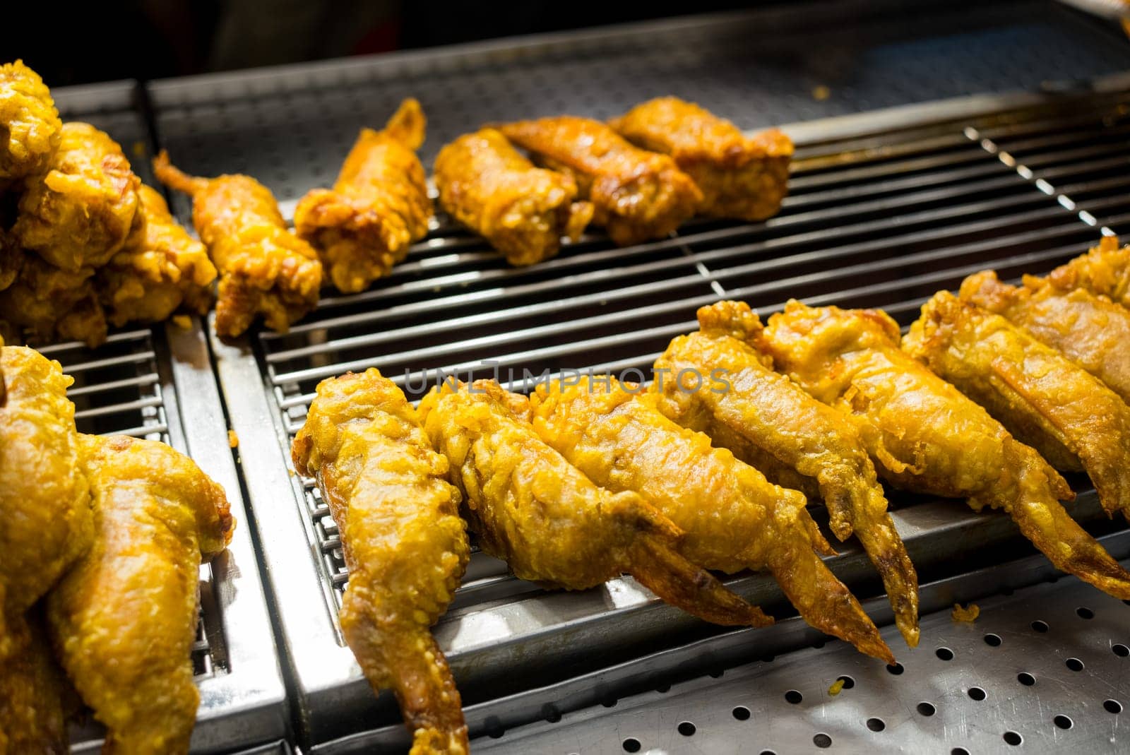 Deep fried chicken wing sell in street market