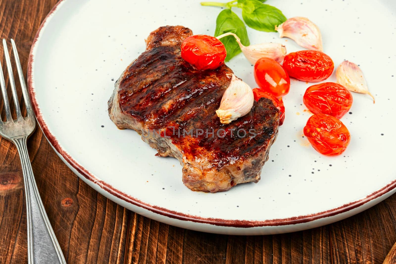 Juicy meat classic grilled steak, beef steak. BBQ, roasted meat.