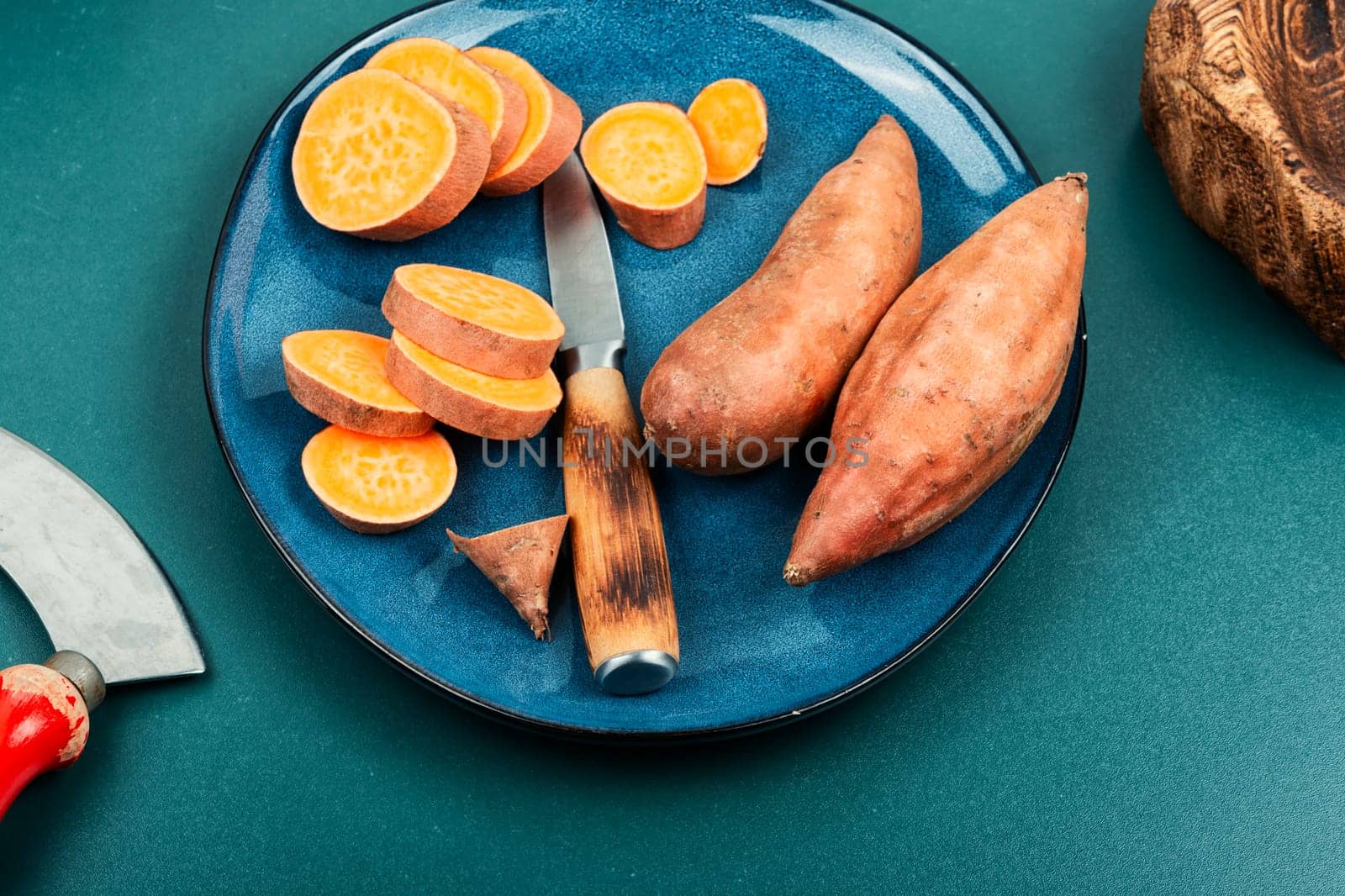 Raw sweet potatoes or batatas. Healthy eating concept, dietary food. Copy space.