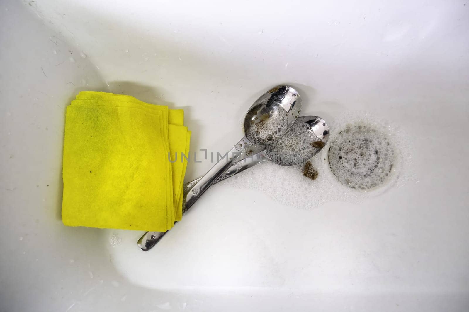 Detail of cleaning dishes with soap and water, hygiene