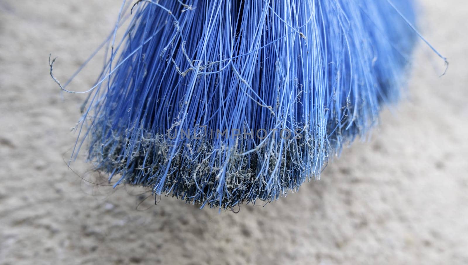 Detail of old dirty and damaged sweeping broom