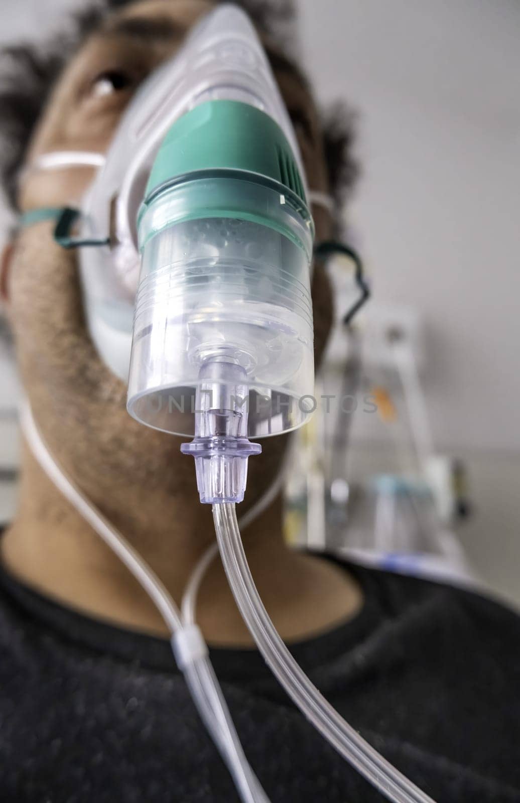 Detail of a sick person in a hospital with oxygen to breathe