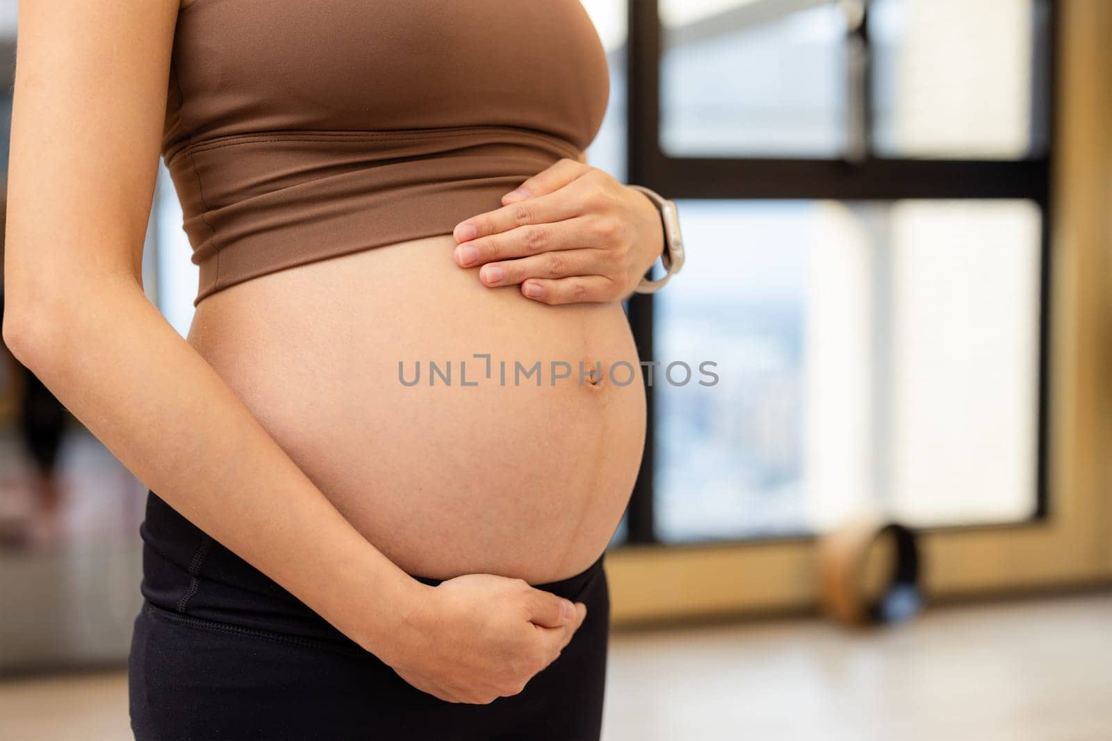 Pregnant woman in the yoga studio