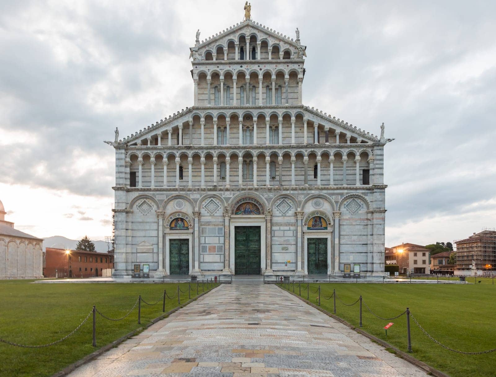 Pisa, Italy - 29 June 2023: cathedral sightseeing, travel destination, sunrise light, famous artistic building