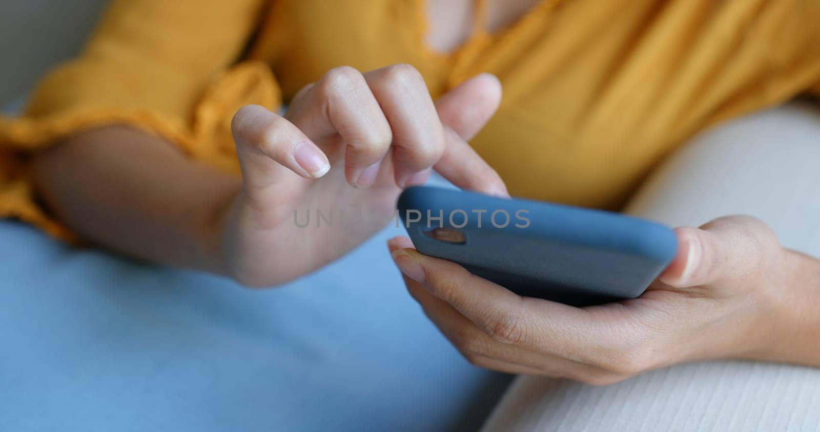 Woman use of mobile phone at home
