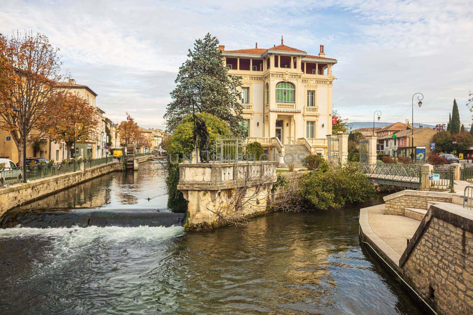L'Isle-sur-la-Sorgue, France - November 27 2023: L'Isle-sur-la-Sorgue, a town famous for antiques, vertical photography in Provence, France