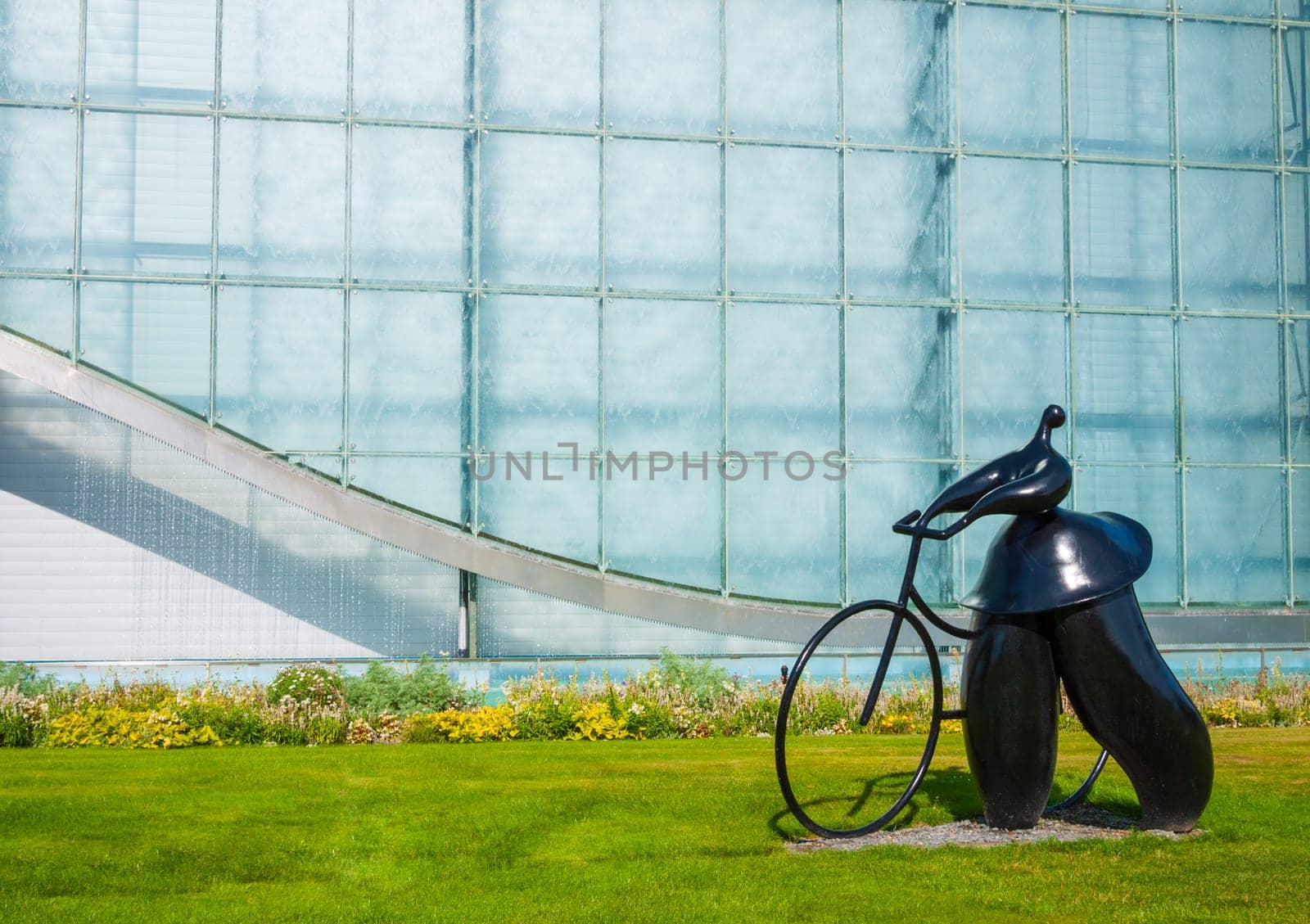 Poitiers, France - September 18 2010 : Sculpture of cyclist and bike from Jean-Louis Toutain in Futuroscope theme park in Poitiers, France