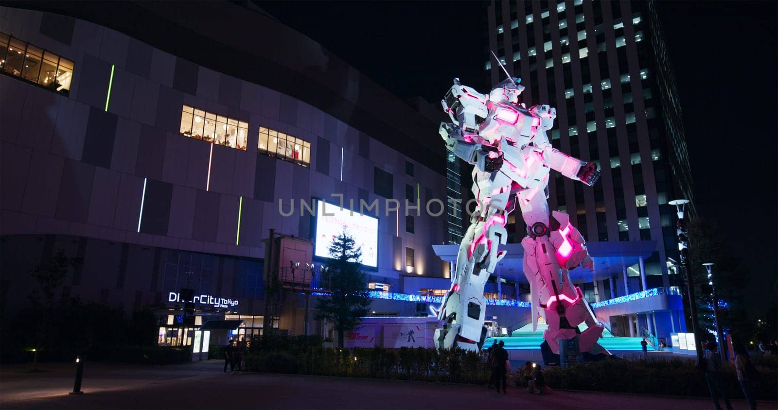Tokyo, Japan 30 June 2019: Unicorn Gundam robot statue in odaiba at night