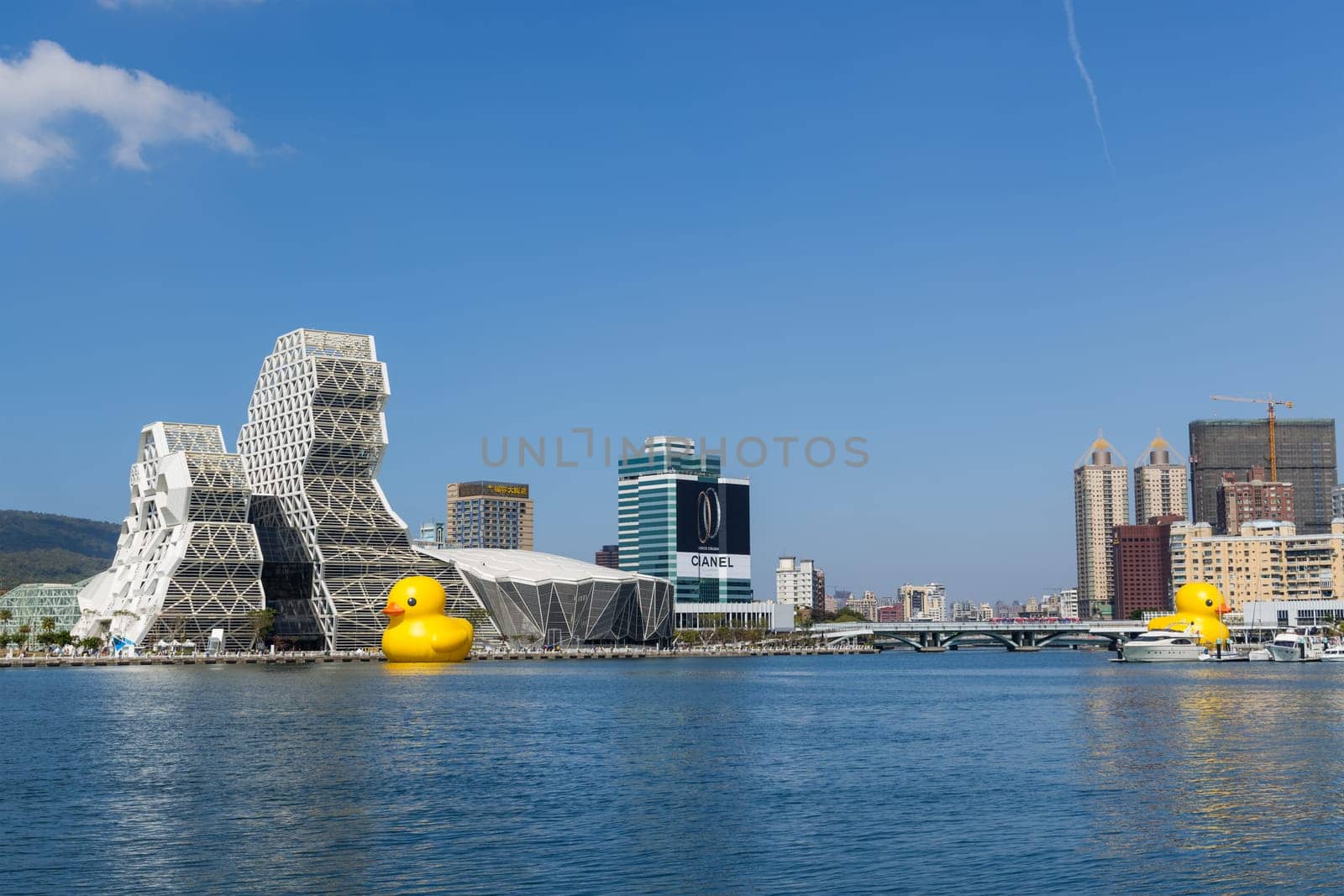 Taiwan, 01 February 2024: Kaohsiung Music Center with yellow duck floating over the bay
