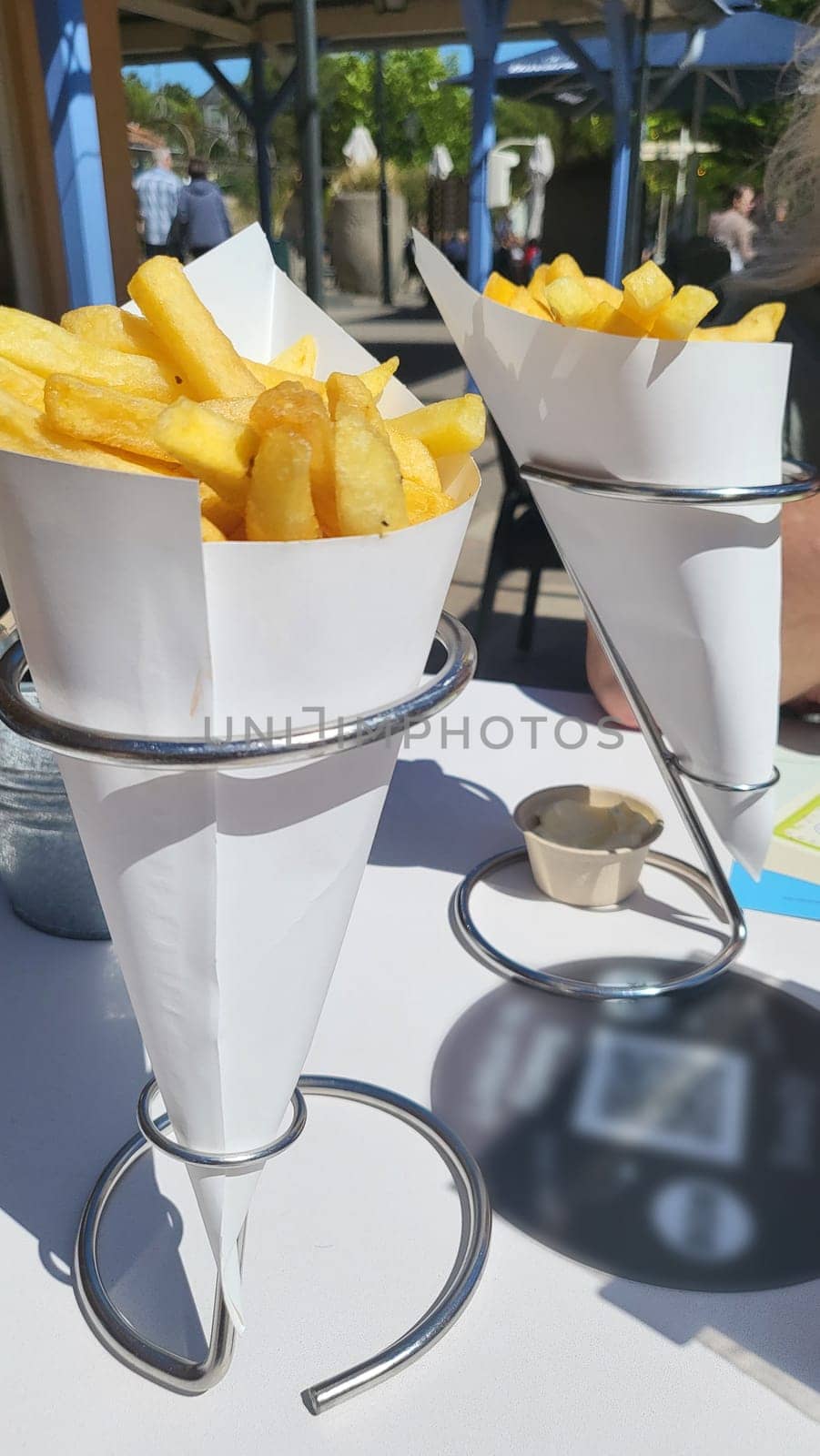 French fries in kraft paper box isolated on white background