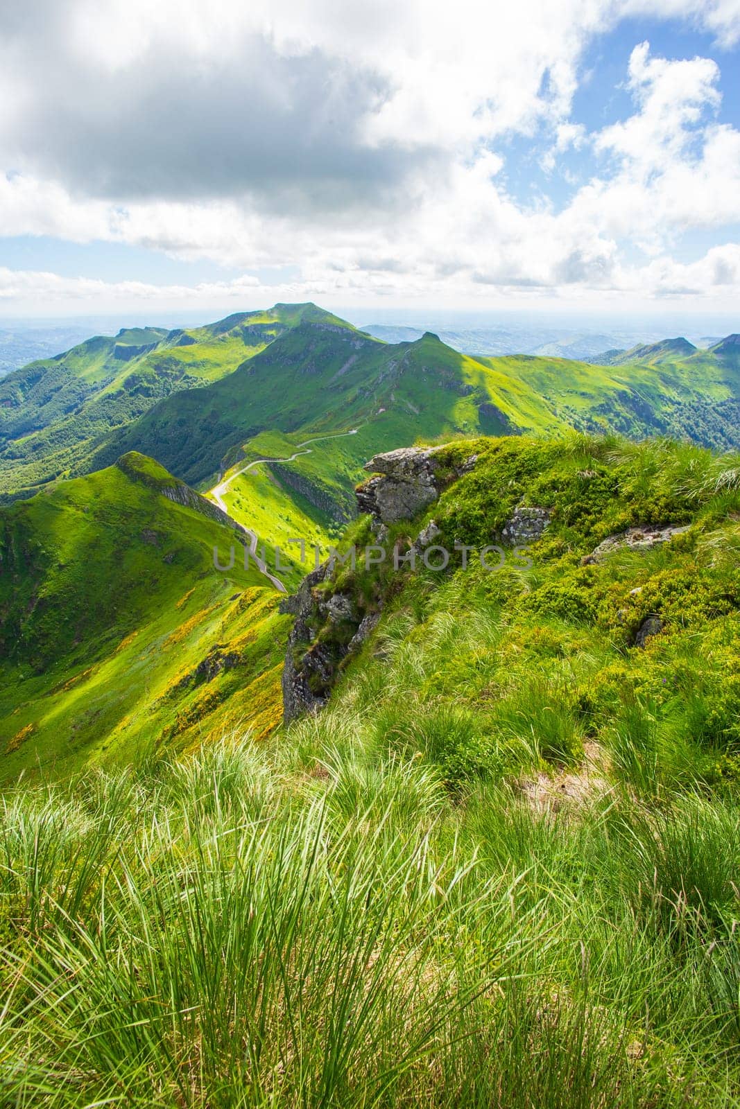 Panoramic landscape of volcanic mountains (vertical view from Puy Mary, Massif Central, France). Photography taken in France