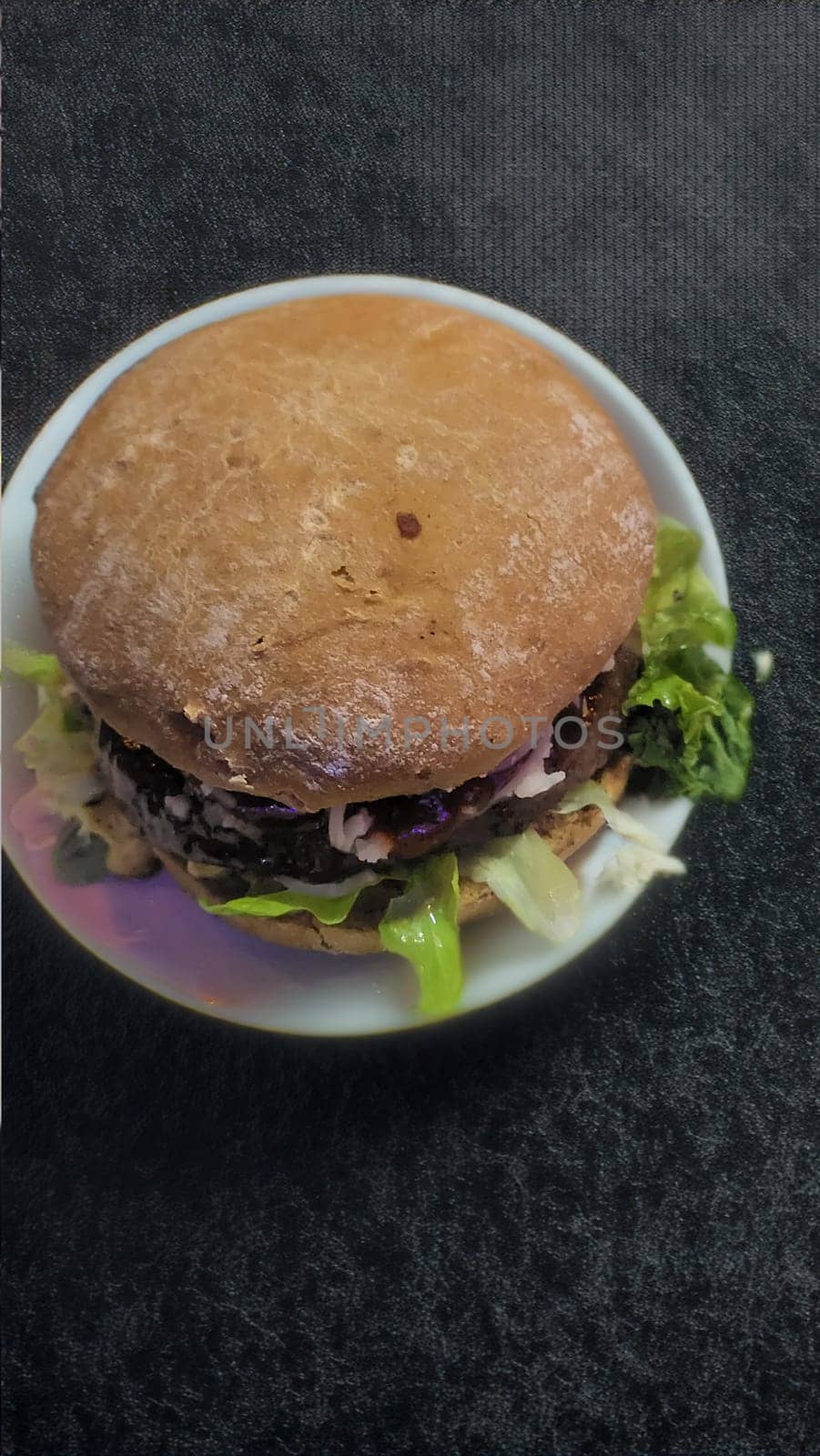 Masterpiece from the grill: Juicy hamburger with fresh ingredients