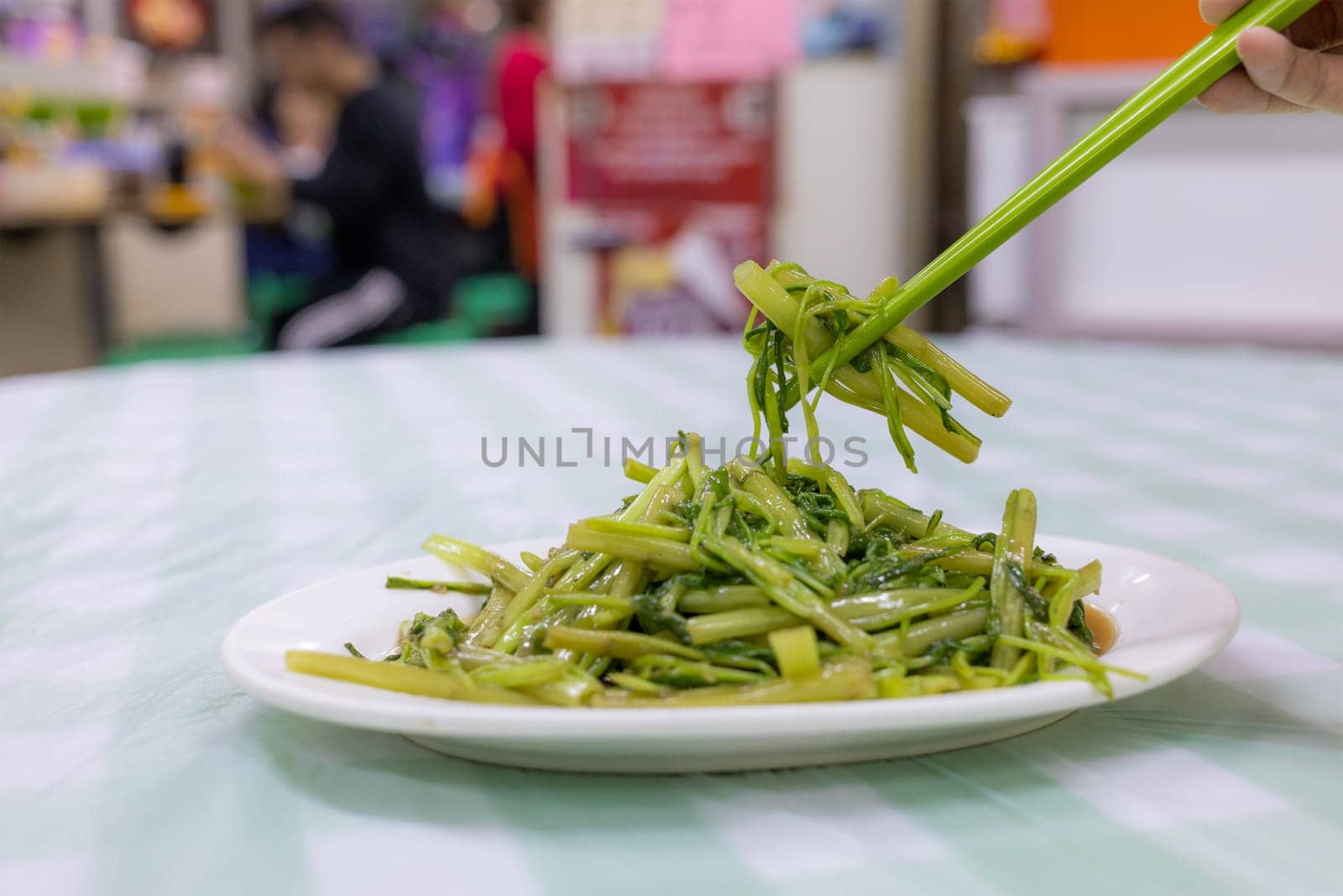 Fried water spinach dishes in restaurant