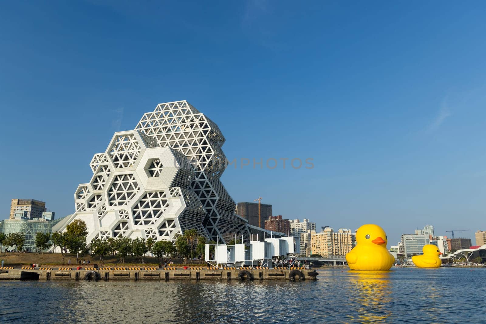 Taiwan, 01 February 2024: Kaohsiung Music Center with yellow duck floating over the bay