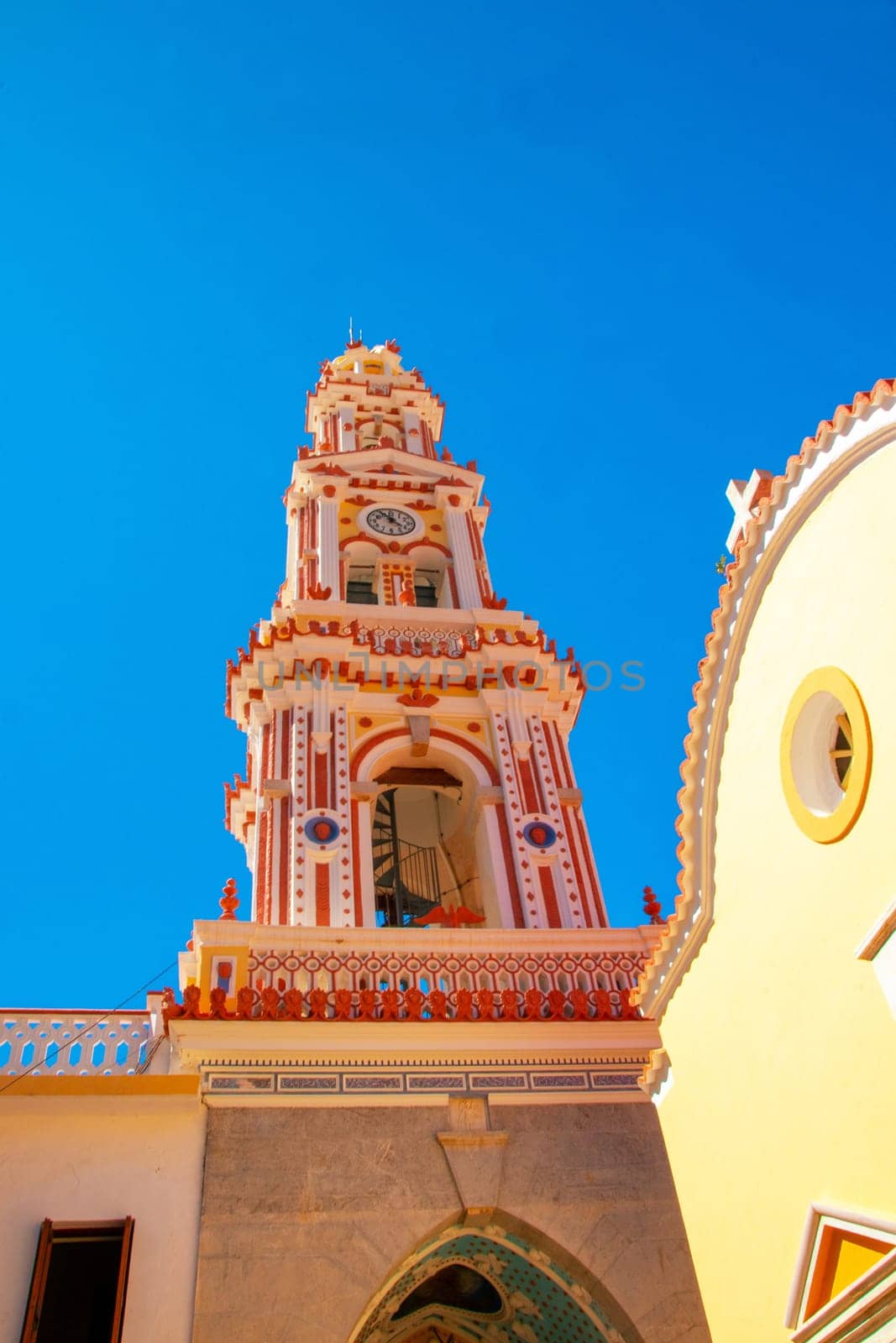 SYMI, Greece - JUN 03, 2021. SYMI, Greece - JUN 03, 2021. Panormitis Monastery of Archangel Michael in the southwest of the island of Symi is an important orthodox pilgrimage site and an important tourist attraction.