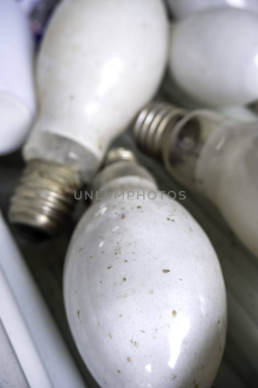 Detail of old damaged and discarded light bulbs, recycling
