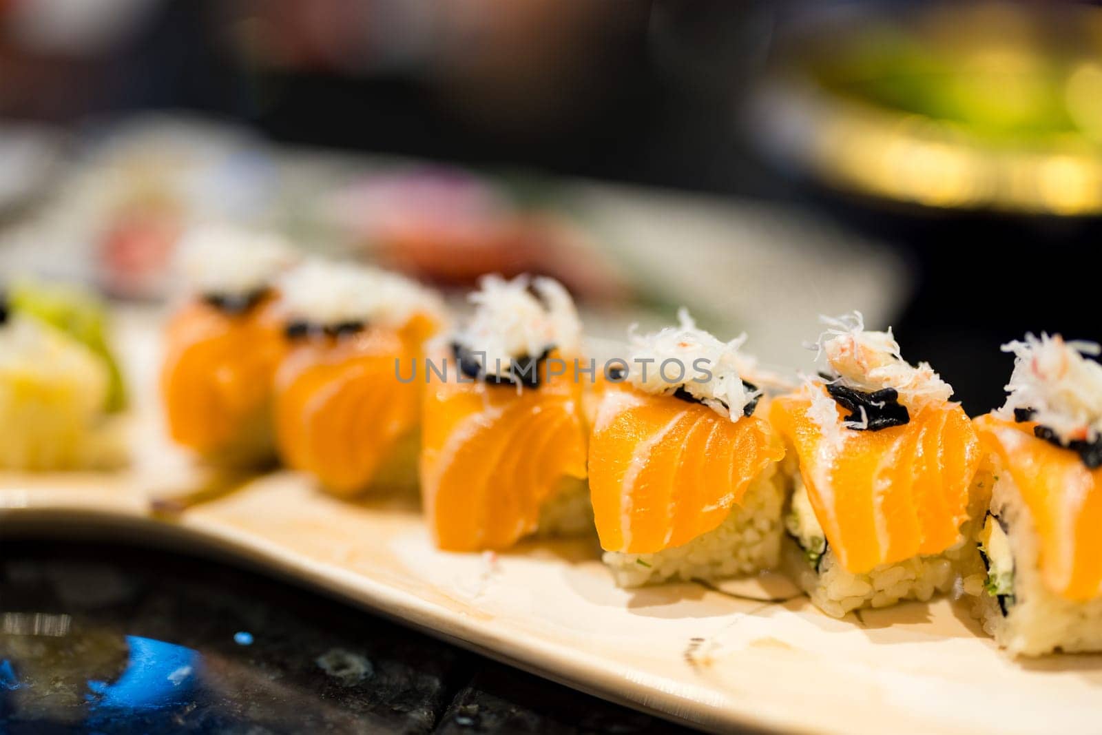 Salmon sushi roll in Japanese restaurant