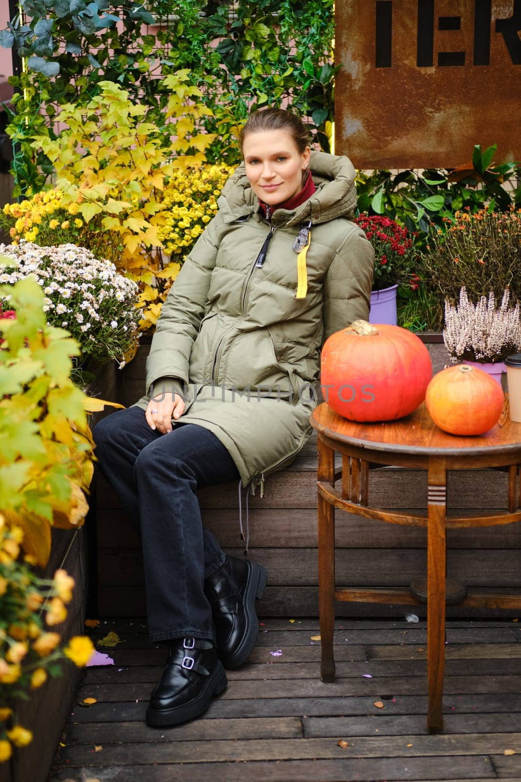 Cheerful woman at autumn outdoor market