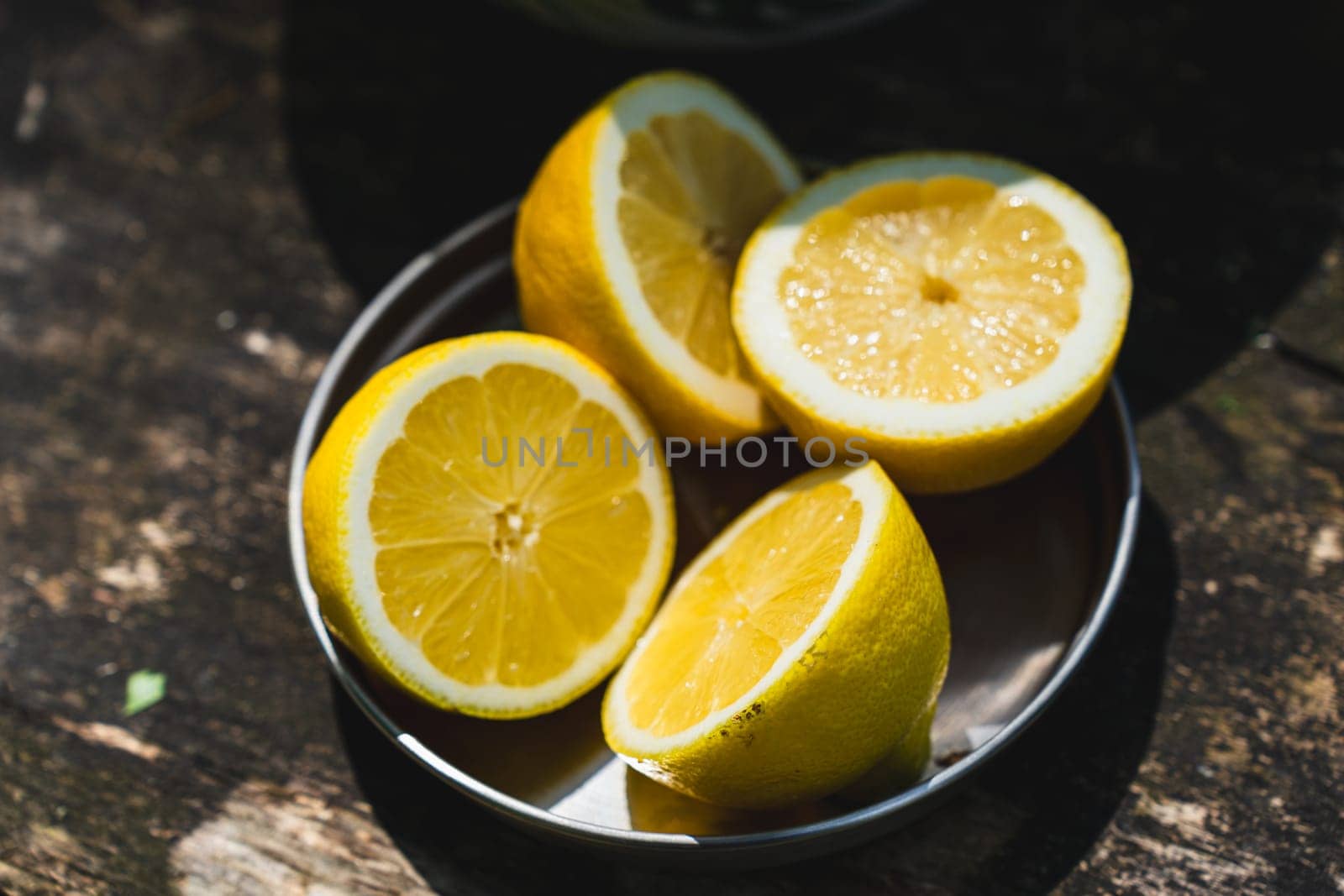 Fresh lemons arranged neatly on a rustic wooden table, ready to be used for refreshing lemonade or zesty recipes.