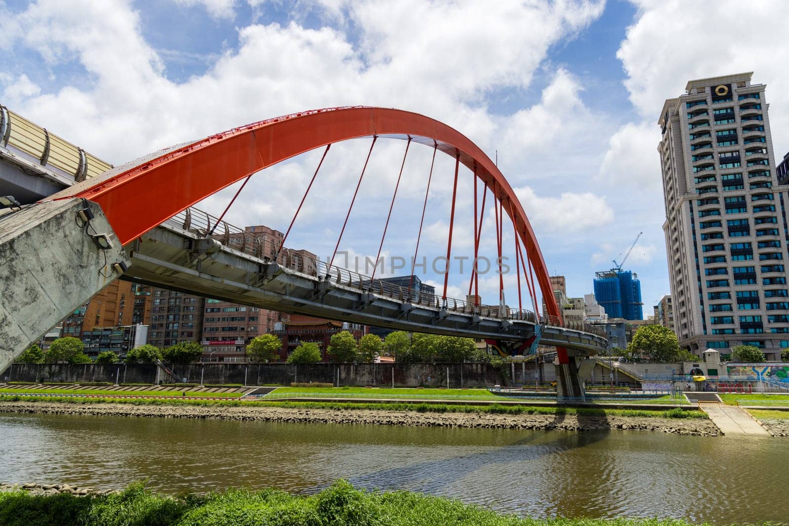 Taipei, Taiwan 25 July 2023: Red bridge over the river in Taipei city