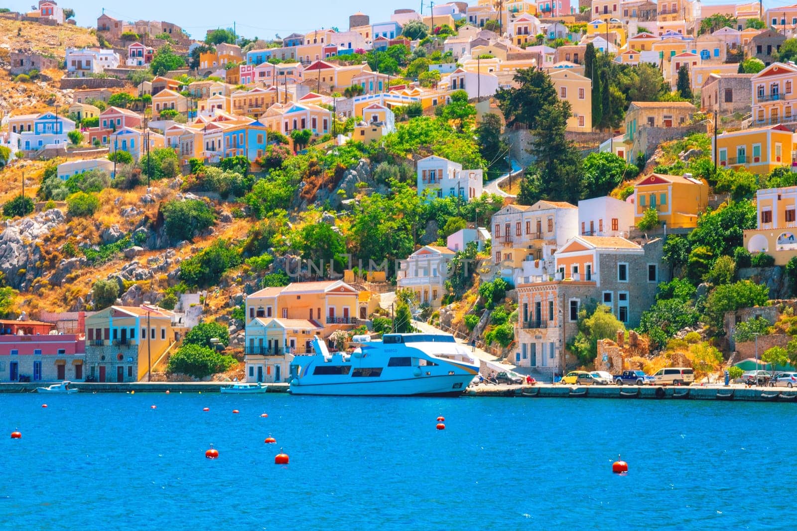 SYMI, Greece - JUN 03, 2021 The ship is moored in the port of Symi, belongs to the Sebeco Lines fleet and sails back to the island of Rhodes. It offers space for 200 passengers.