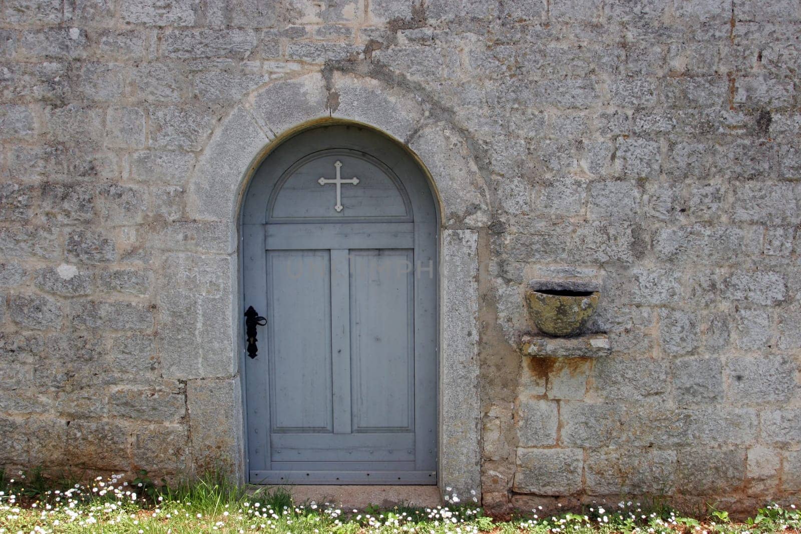 The door of the Church of the Holy Trinity in Labinci, Croatia