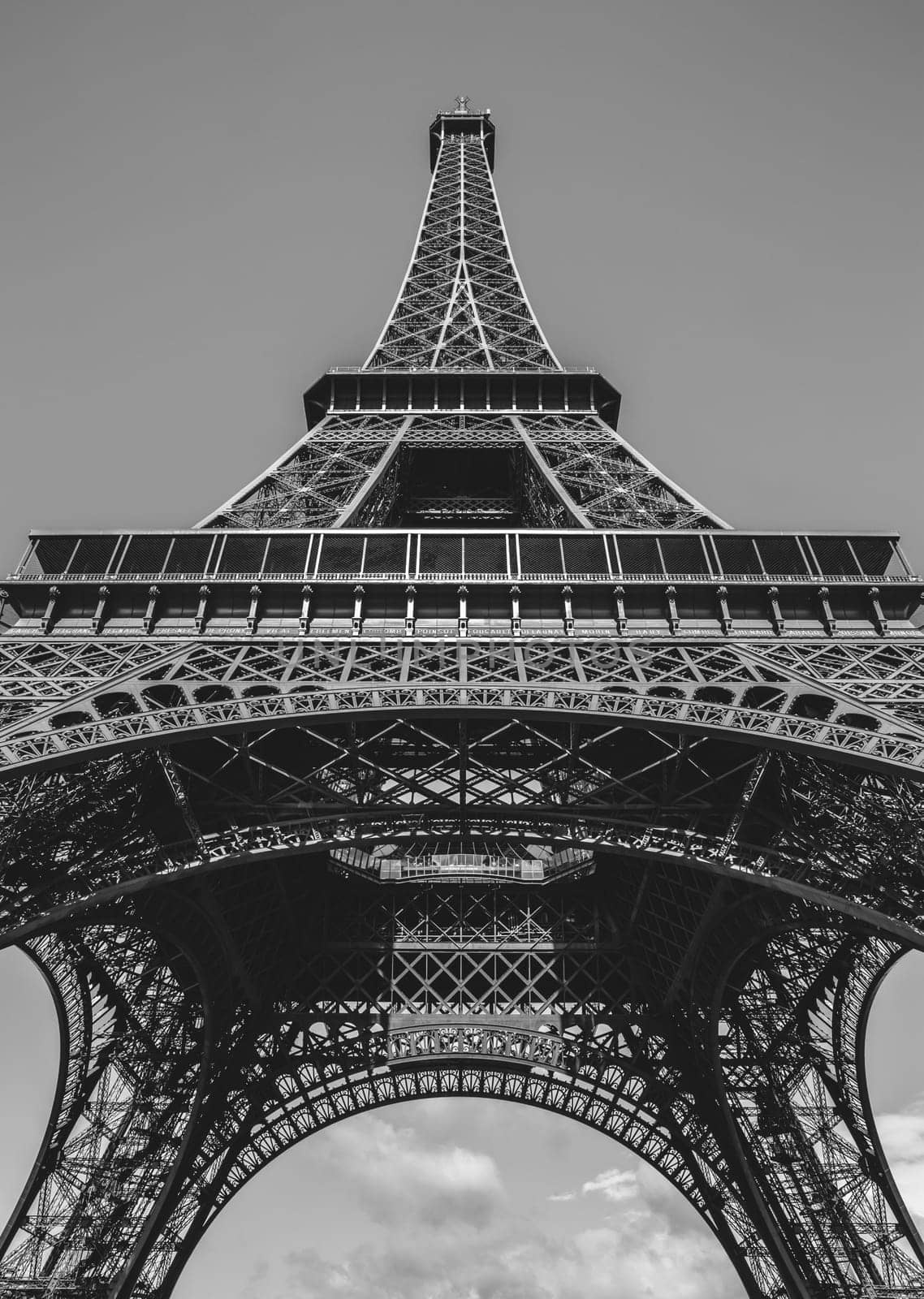 Looking up at the Eiffel Tower in Paris, France done in black and white.