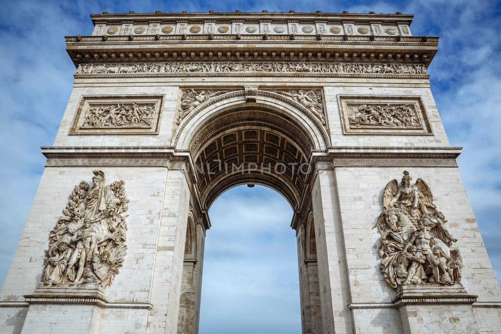 Arch of Triumph on a sunny day in Paris, France.