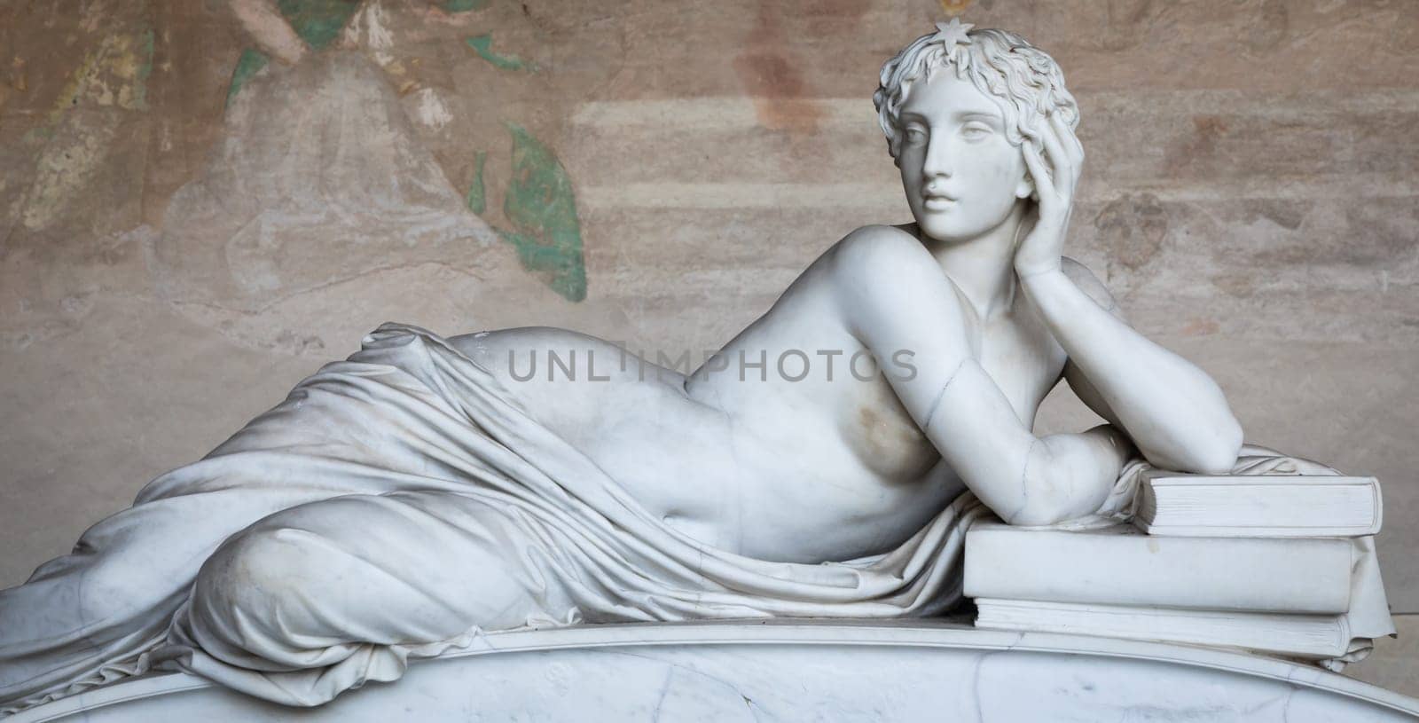 Pisa, Italy - 29 June 2023: sad statue in cemetery. Vintage white marble sculpture, woman sorrow