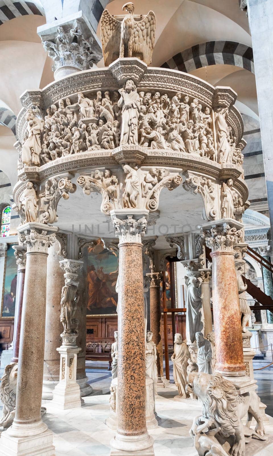 Pisa, Italy - 29 June 2023. Cathedral interior. The pulpit, Medieval art masterpiece by sculptor Giovanni Pisano, 1310