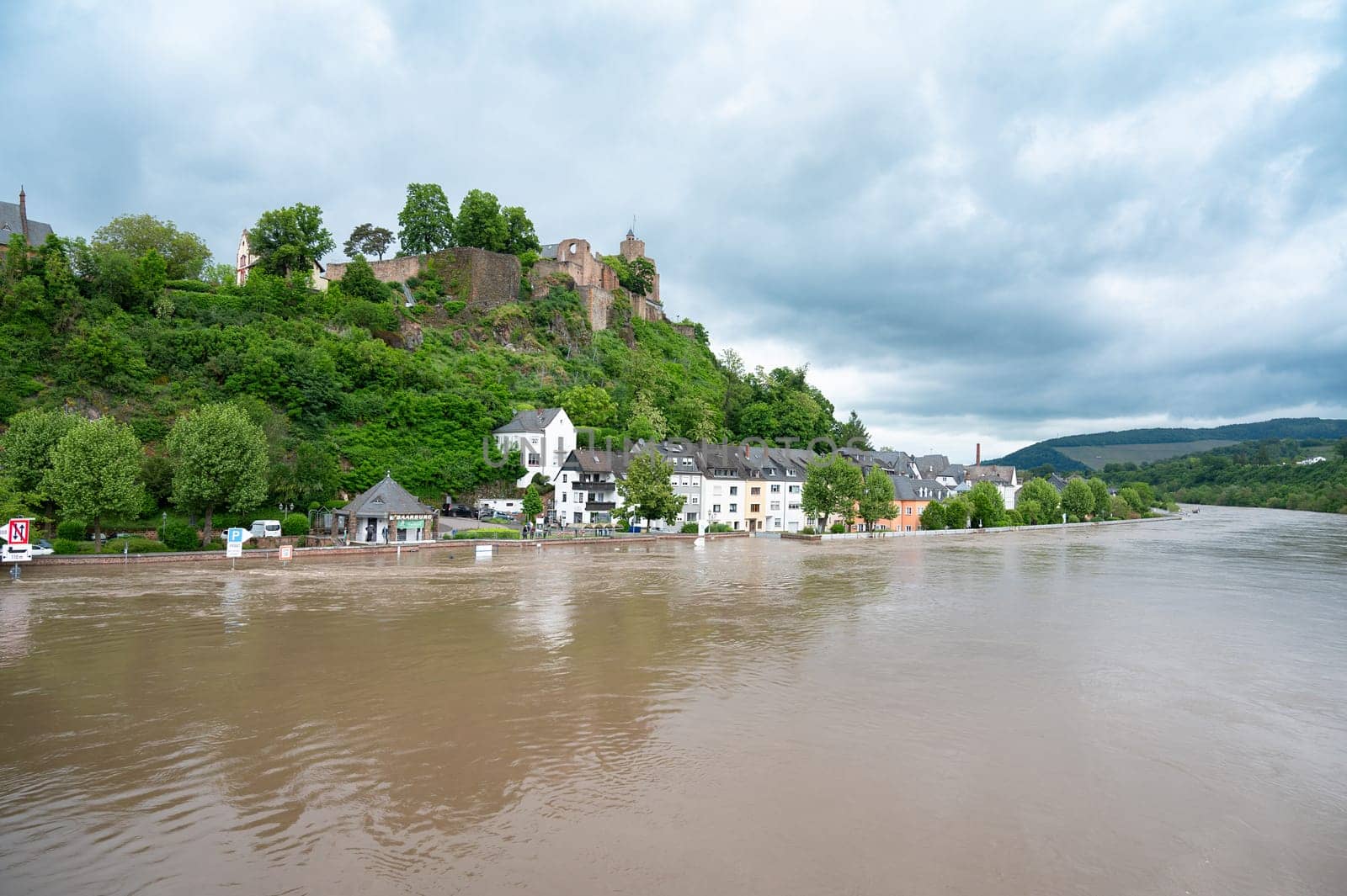 Flood of the river Saar, Saarburg in Saarland, Germany, flooded trees and paths, high water level, climate change