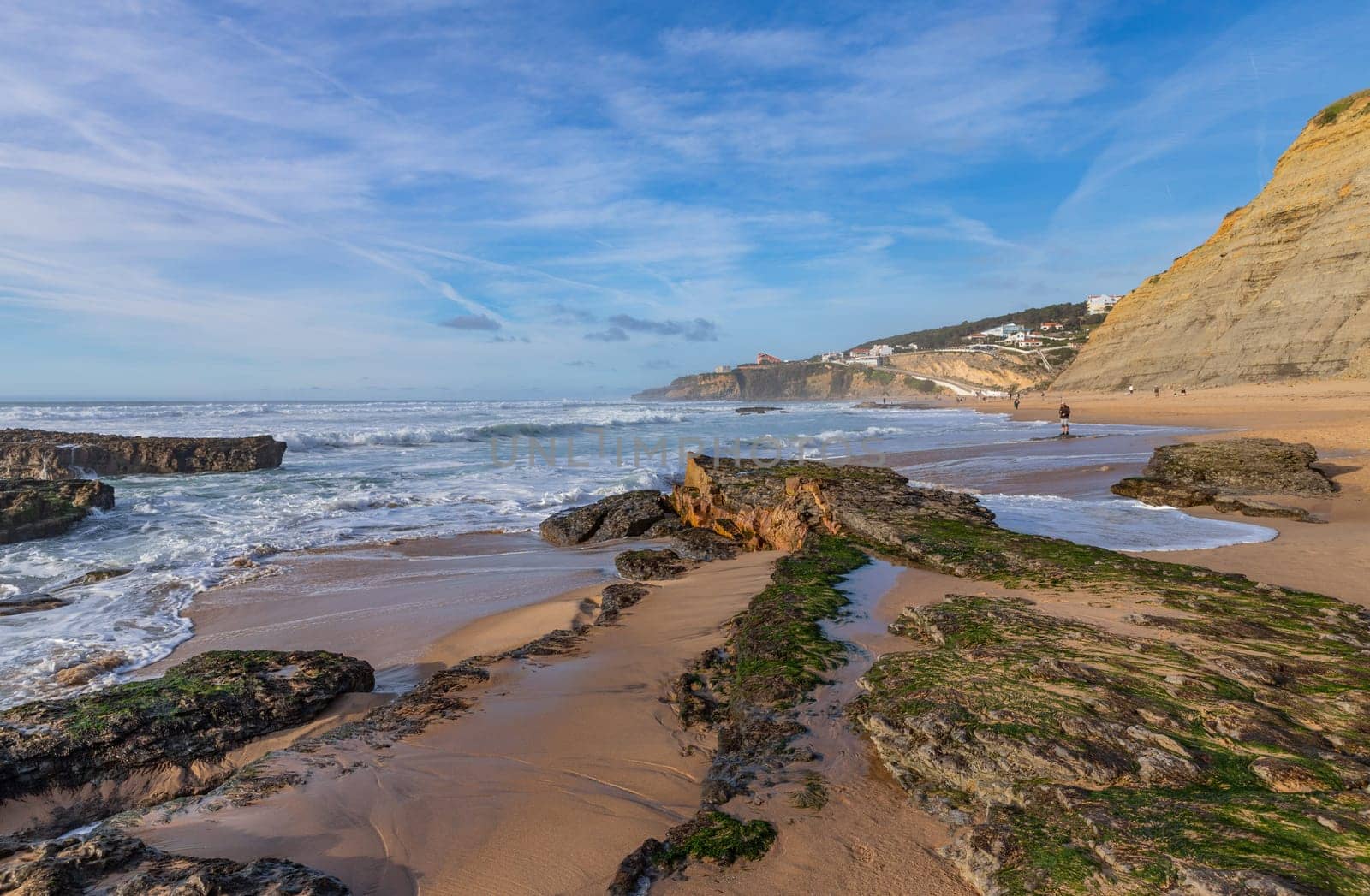 Sintra, Portugal: February 17, 2024: People at the beach of Magoito in a winter day, Sintra, Portugal
