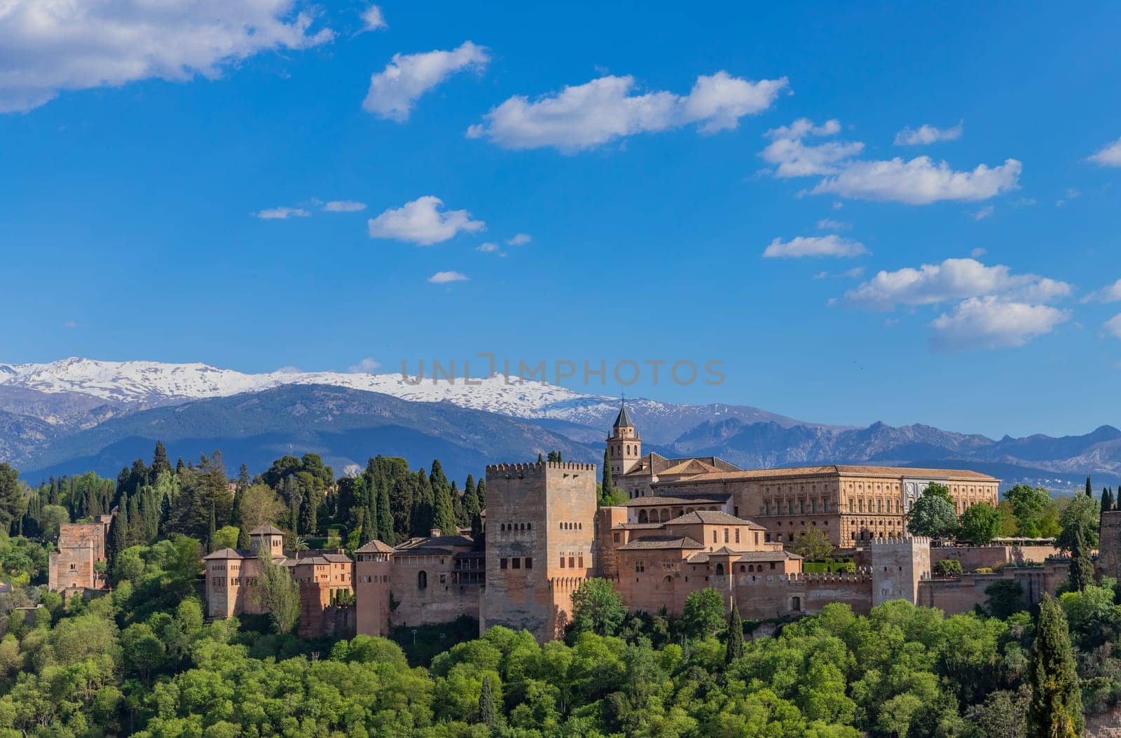 Alhambra palace with the snowy Sierra Nevada in the background, Granada, Andalusia, Spain