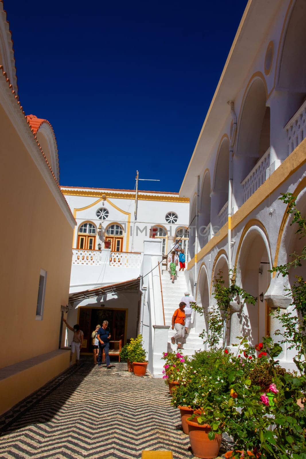 SYMI, Greece - JUN 03, 2021. SYMI, Greece - JUN 03, 2021. Panormitis Monastery of Archangel Michael in the southwest of the island of Symi is an important orthodox pilgrimage site and an important tourist attraction.