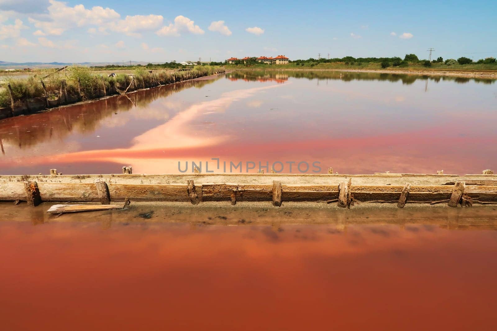 One of the pools at the Burgas Salt Pans, water of intense pink color, Lake Atanasovsko, Atanasovo, Burgas, Bourgas, Bulgaria 2022