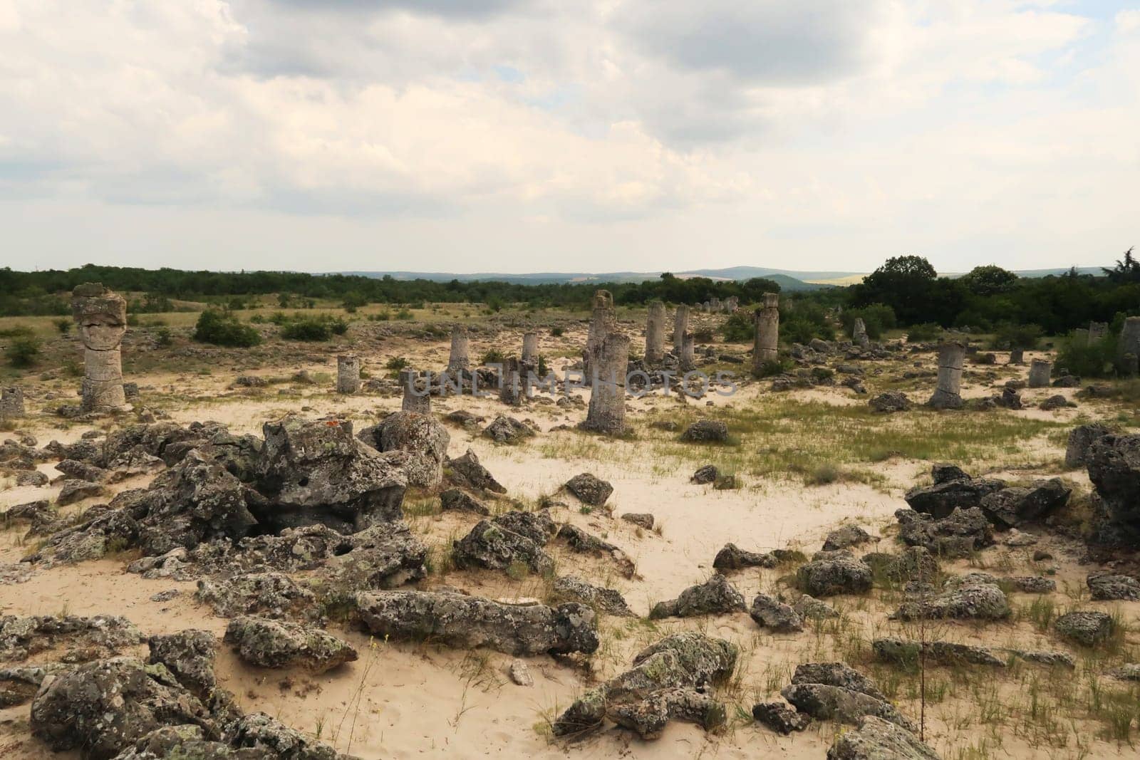View over the stone forest of Pobiti Kamani, many stone pillars are rising from a desert-like landscape near Varna, Bulgaria 2022