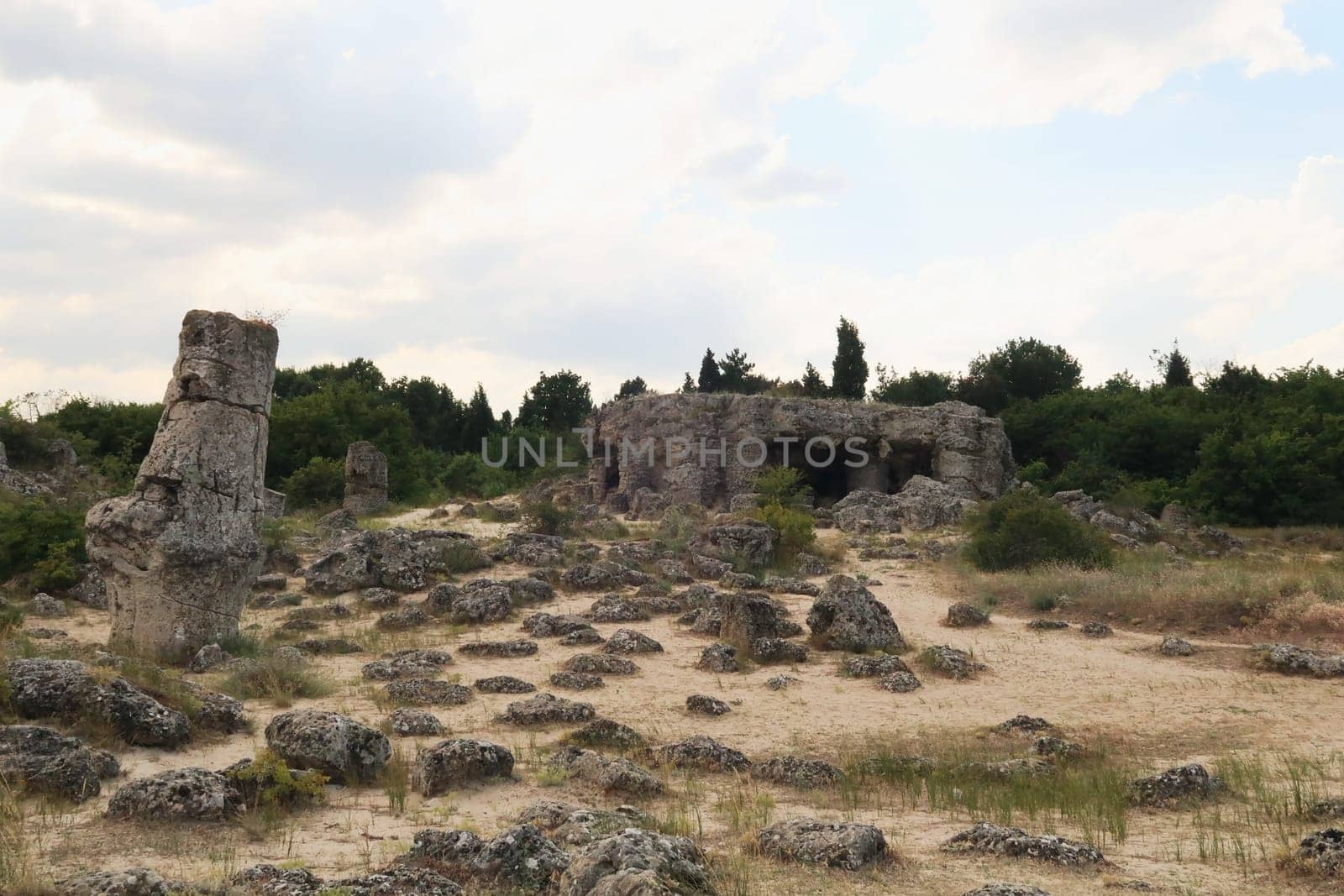 View onto a big rock formation in the shape of a roof on pillars at the Pobiti Kamani stone forest, close to Varna, Bulgara 2022