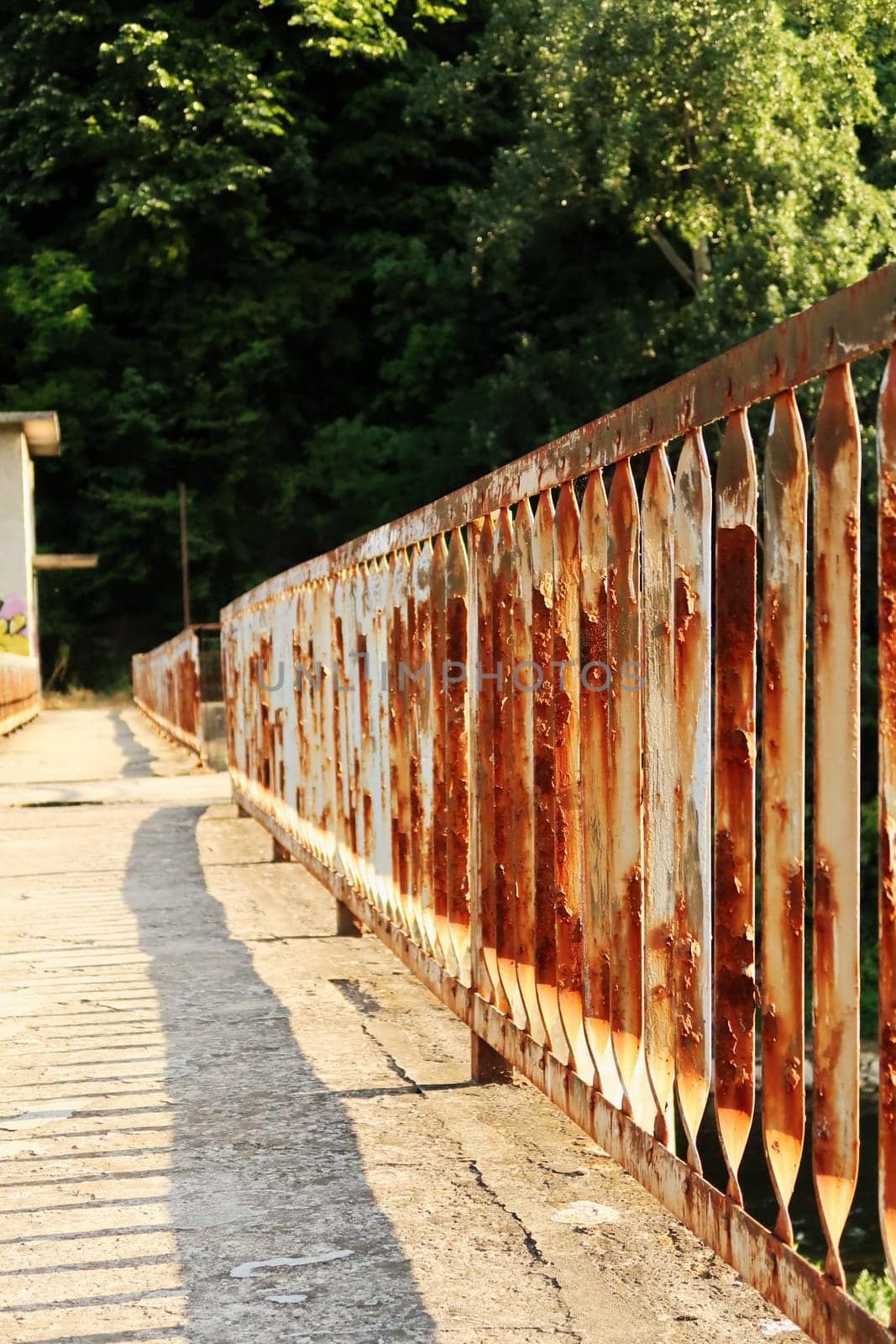 Rusted, rusty railing, handrail, rail at an abandoned dam on the Yantra River in Veliko Tarnovo, Bulgaria 2022
