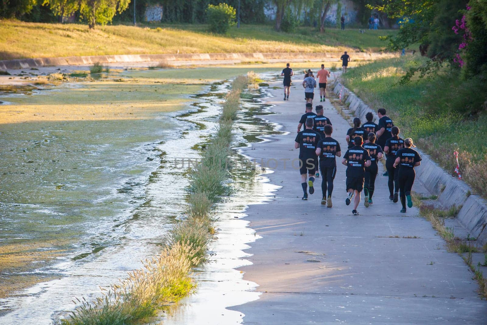 Merida, Spain - May 18th, 2024: FarinatoRace Merida 2024. Participants running along the Albarregas river