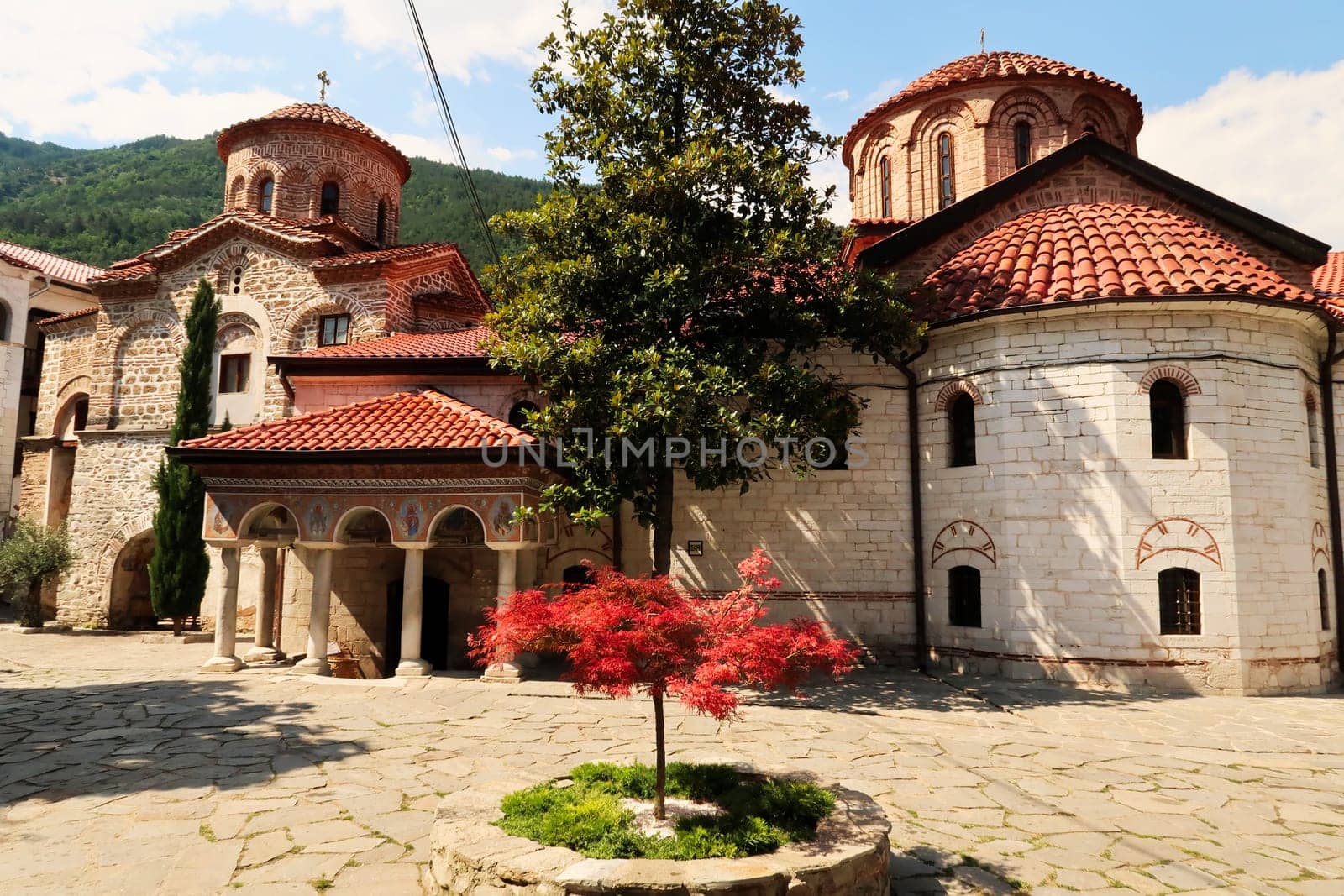 View over the courtyard to the main church Assumption of the Holy Virgin and the St., Saint Archangels Michael and Gabriel Church, Bachkovo Monastery, close to Plovdiv, Bulgaria 2022