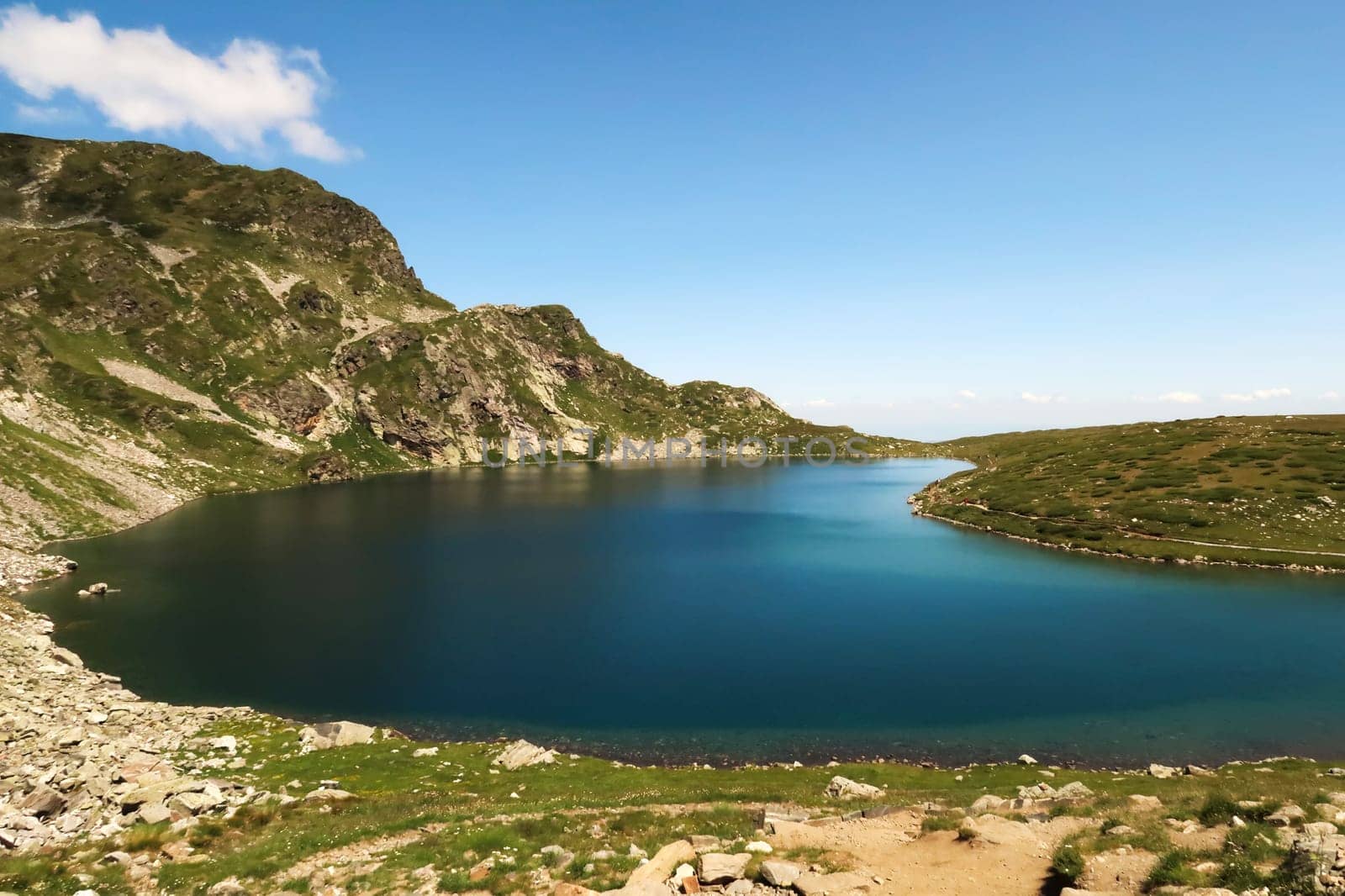 Spectacular view onto the deep blue Kidney, Babreka Lake, one of the Seven Rila Lakes, situated on a plateau in the Rila National Park, close to Sofia, Bulgaria 2022