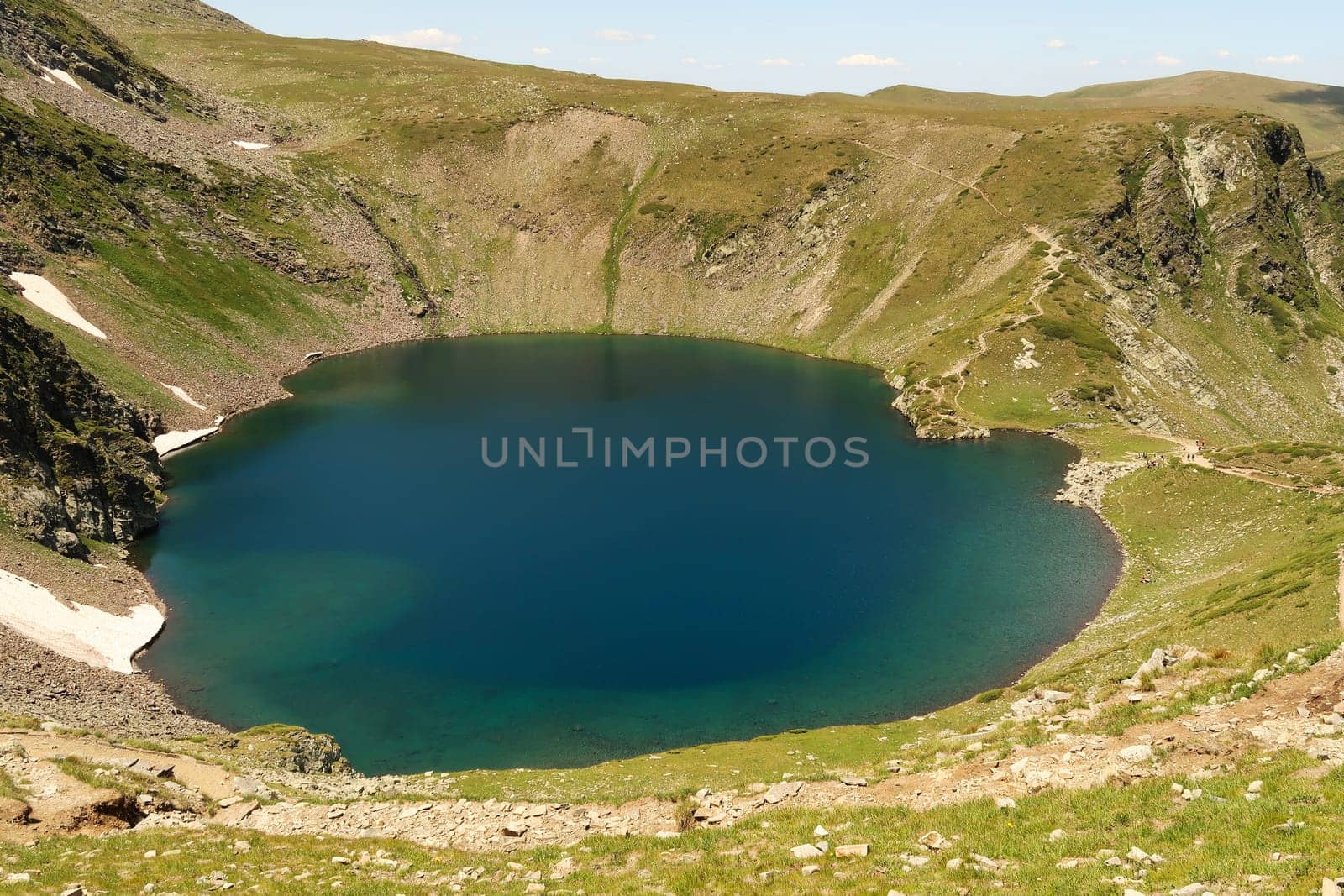 Spectacular view onto the deep blue Eye, Okoto Lake, one of the Seven Rila Lakes, situated on a plateau in the Rila National Park, close to Sofia, Bulgaria 2022